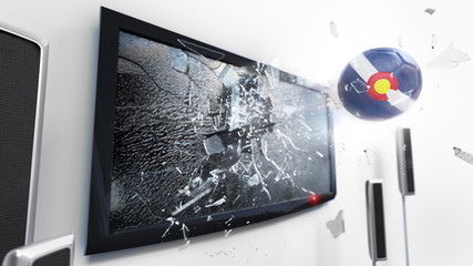 Soccer ball with the flag of Colorado kicked through a shattering tv screen.(3D rendering series)