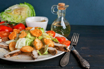 Ice salad with chicken breast and cherry tomatoes.