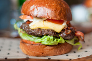 Hamburger with, beef,cheddar, lettuce, bacon and tometoes