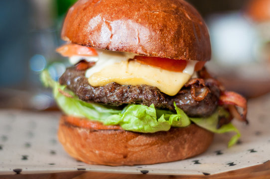Hamburger with, beef,cheddar, lettuce, bacon and tometoes