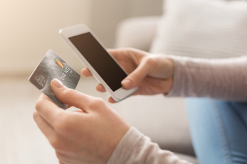 Unrecognizable woman at home shopping online