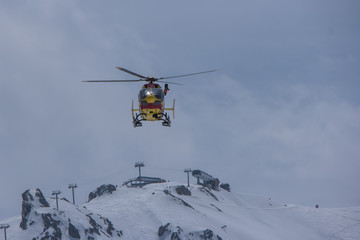 Fototapeta na wymiar Helicopter of the civil security in the French Alps resort in the sky