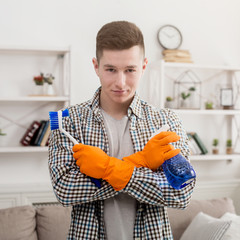 Young smiling man ready to clean home