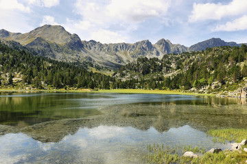 Reflection at the first lake in the circuit of Lake Pessons, Andorra