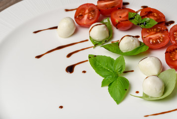 Caprese salad skewer with tomato, mozzarella and basil italian food and healthy vegetarian diet