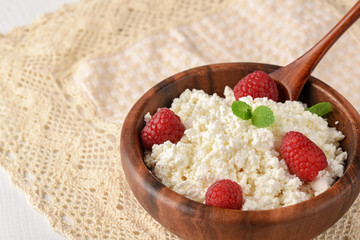 Dairy products milk cottage cheese, sour cream and fresh raspberry