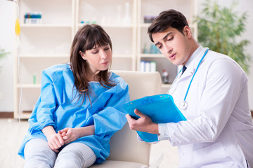 Fototapeta premium Doctor discussing blood transfusion with patient