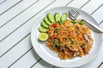 fired rice with pork on white table