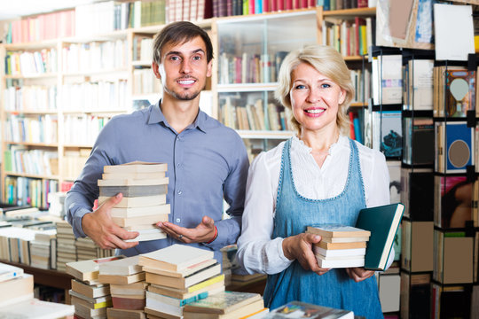 woman and man with books in shop