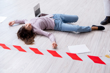 Dead woman on the floor after commiting suicide