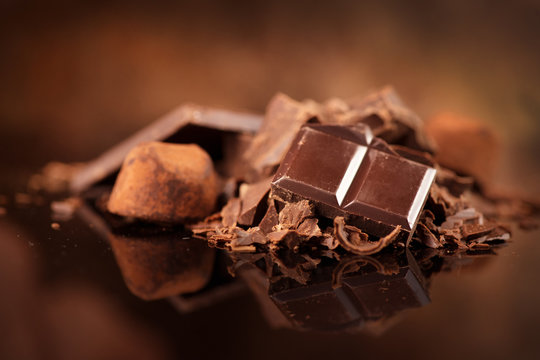 Chocolate. Assorted chocolate sweets and candies over dark background. Confectionery