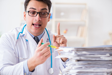 Busy doctor with too much work in hospital