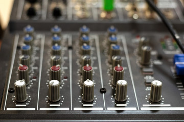 Audio mixing board. Sound mixing console and buttons of mixer controller.