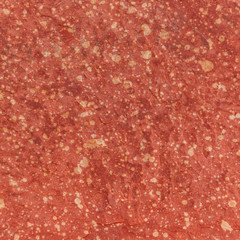 Red rough stone texture background. Material construction and architectural detail.