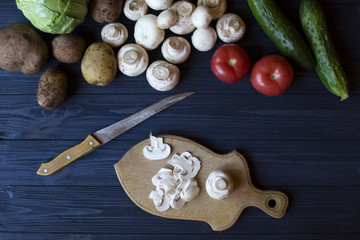 Vegetables on a rustic table. Organic ingredients for cooking.