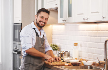 man cooks baking   cookies at home