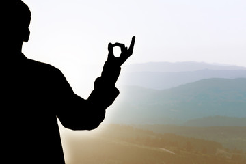 silhouette with meditation and yoga gesture