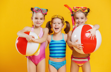 funny funny happy children  jumping in swimsuit  jumping  on colored background