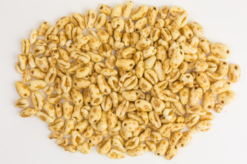 heap of puffed wheat cereal with honey