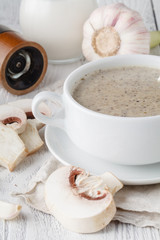 Homemade mushroom cream soup on the wooden table