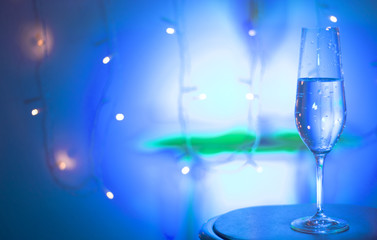 Champagne glass in disco party bar