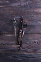 Fork and knife on a wooden table