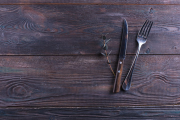 Fork and knife on a wooden table