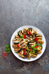 Salad with grilled vegetables and mushrooms. Vegetable salad with grilled champignons. Grilled salad on plate