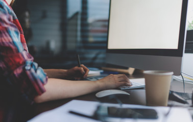 Cropped shot of a female hands of a young professional graphic designer who works for a modern computer using a graphic tablet and stylus to create graphics. architect making drawings for project