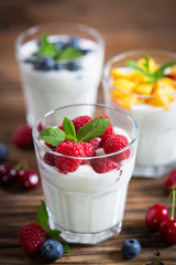 Fresh fruit yogurt with fresh berries and peaches