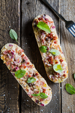 Pizza on baguette with basil