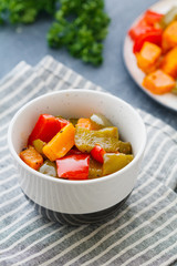 Tossed vegetables salad with roasted bell peppers and pumpkin.