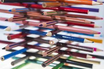 Colored pencils on table.