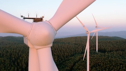 Aerial view of a Windmill close to the hub at the sunset