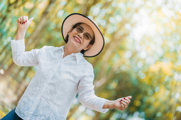 happiness retired with freedom and joyful with grandmom dance and sing a love song in garden landscape background