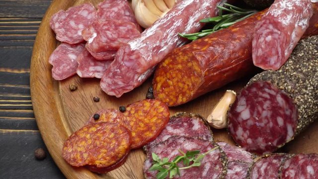 salami and chorizo sausage close up on wooden background