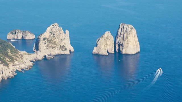 Aerial view of famous Faraglioni rocks from Capri island, Italy.