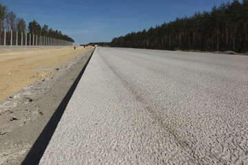 paved surface of a new unused highway