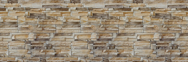 Stone wall brick texture. Seamless pattern. Background of the Sandstone facade.