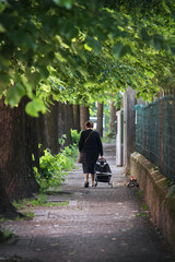 lonely old woman walking, she's evicted from home
