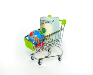 Money dollars, globe and shopping cart on a white background.Shopping concept around the world.Electronic commerce.