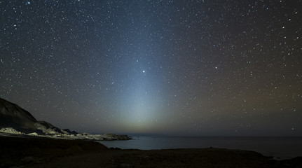 Ray of sunlight at night, north coast of Chile. - obrazy, fototapety, plakaty