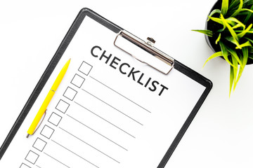 Blank checklist with space for ticks on pad on office desk. Checklist for office worker, manager,...