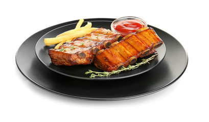 Plate with delicious grilled ribs on white background