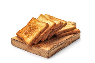 Wooden board with toasted bread on white background
