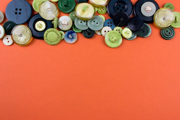 Clothes buttons. Free space for text and design. Orange texture