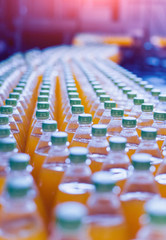 Obraz premium Conveyor with bottles for juice or water. Beverages factory equipments