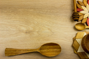 Handmade various wooden utensils. Kitchen equipment concept. Wooden desk texture
