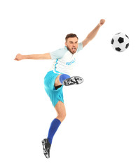 Fototapeta na wymiar Young man playing football on white background