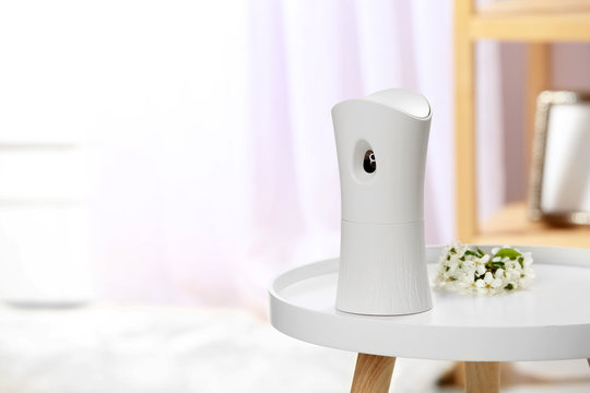 Automatic Air Freshener On Table In Room